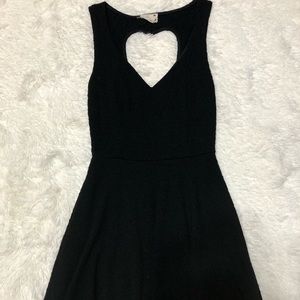 Mini black dress with heart shape opening on back